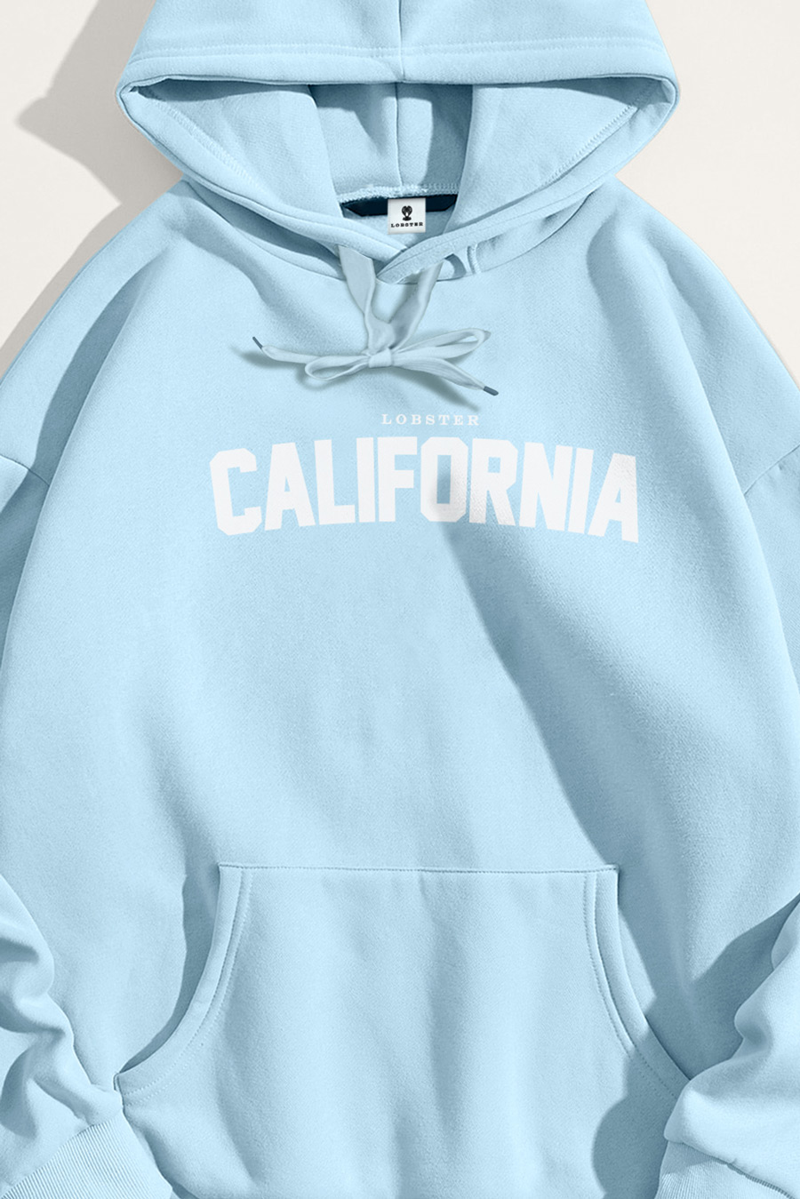 crop3-hoodie-flat-lay-ag-light-blue-5635